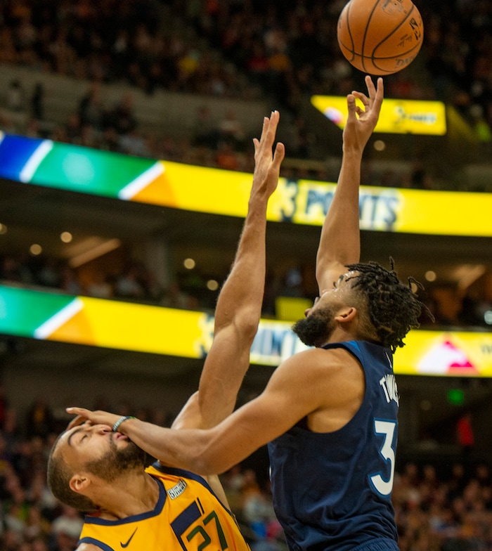 (Rick Egan  |  The Salt Lake Tribune)     Utah Jazz center Rudy Gobert gets a hand in his face as (27) Minnesota Timberwolves center Karl-Anthony Towns (32) shoots, in NBA action between the Utah Jazz and the Minnesota Timberwolves in Salt Lake City, Monday, Nov. 18, 2019.