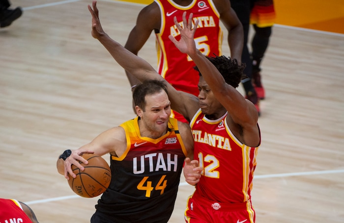 (Rick Egan | The Salt Lake Tribune)Utah Jazz forward Bojan Bogdanovic (44) gets past Atlanta Hawks forward De'Andre Hunter (12) as he goes to the hoop, in NBA action between the Utah Jazz and the Atlanta Hawks at Vivint Arena, on Friday, Jan. 15, 2021.,