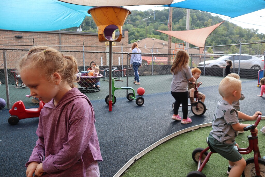 (Leah Willingham | The Associated Press) Children play on a rubber playground purchased in part with the support of pandemic-era stabilization aid on Monday, Sept. 25, 2023.
