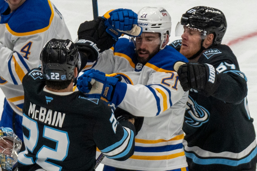 (Rick Egan | The Salt Lake Tribune) Utah left wing Lawson Crouse (67) tries to break up a scuffle between Utah Mammoth center Jack McBain (22) and Buffalo Sabres defenseman Conor Timmins (21) in NHL action between the Utah Mammoth and the Buffalo SabresWednesday, Nov. 12, 2025.