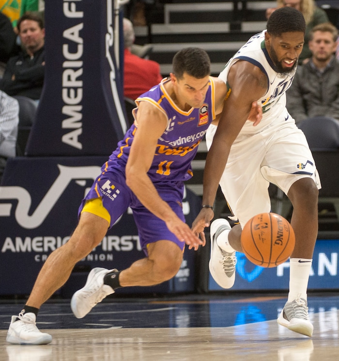 (Rick Egan  |  The Salt Lake Tribune)Utah Jazz forward Royce O'Neale (23) goes for the ball along with Sydney Kings guard Kevin Lisch (11), in preseason basketball Utah Jazz vs.Sydney Kings, in Salt Lake City, Sunday, October 2, 2017.


