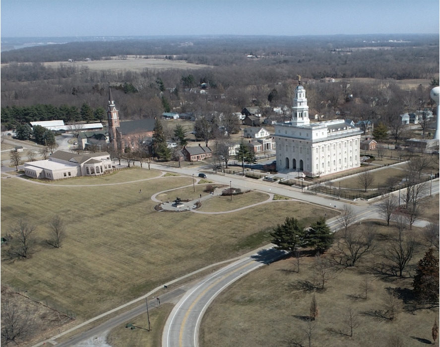 (The Church of Jesus Christ of Latter-day Saints) This photo illustration shows the proposed visitors center at the left of the Nauvoo Temple.