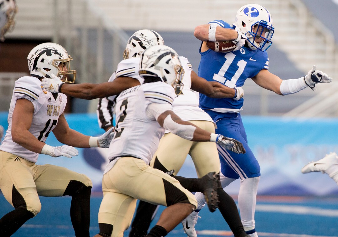 (Jeremy Harmon  |  The Salt Lake Tribune) Brigham Young Cougars defensive back Austin Lee (11) runs the ball after making an interception as BYU faces the Western Michigan Broncos in the Famous Idaho Potato Bowl in Boise, Idaho, on Friday, Dec. 21, 2018.