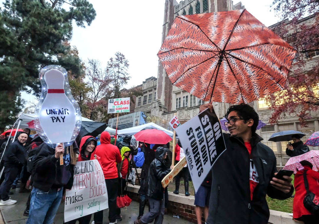 (Ringo H.W. Chiu | The Associated Press)  Teachers strike in the rain outside John Marshall High School, Monday, Jan. 14, 2019, in Los Angeles. Tens of thousands of Los Angeles teachers are striking after contentious contract negotiations failed in the nation's second-largest school district.
