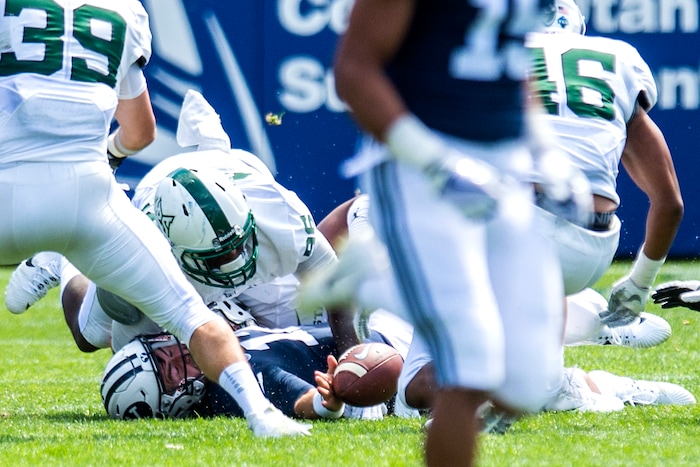 (Chris Detrick  |  The Salt Lake Tribune)  Portland State Vikings defensive end Davond Dade (99) and Portland State Vikings defensive end Larry Ross (96) sack Brigham Young Cougars quarterback Tanner Mangum (12) during the game at LaVell Edwards Stadium Saturday, August 26, 2017.