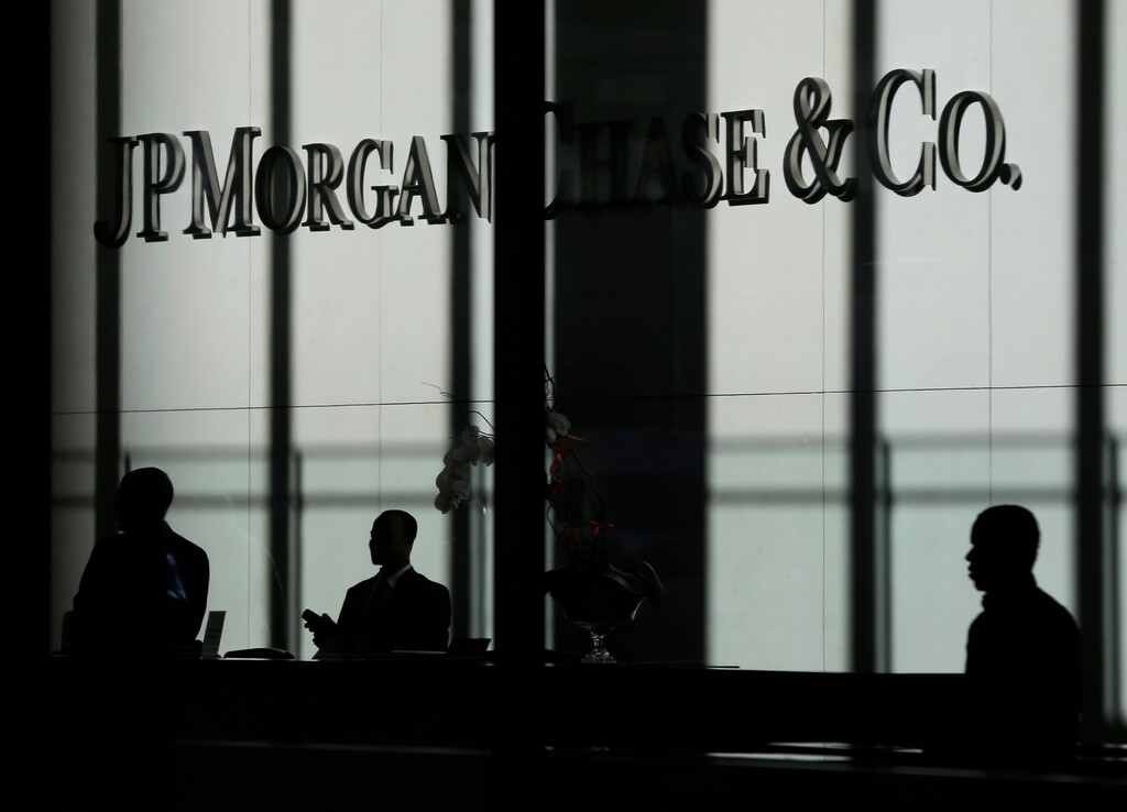 (Seth Wenig | AP file photo) This Oct. 21, 2013, photo shows the JPMorgan Chase & Co. logo displayed at their headquarters in New York.