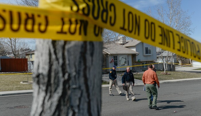 (Francisco Kjolseth | The Salt Lake Tribune) Investigators comb the scene where a Granite School District police officer shot a driver on Tuesday afternoon, March 20, 2018. While on patrol near Hunter High School, the officer noticed a car full of teenagers and smelled marijuana. When he approached the car lurched and he ended up on the hood. The driver was shot and four other teens in the car fled the scene.