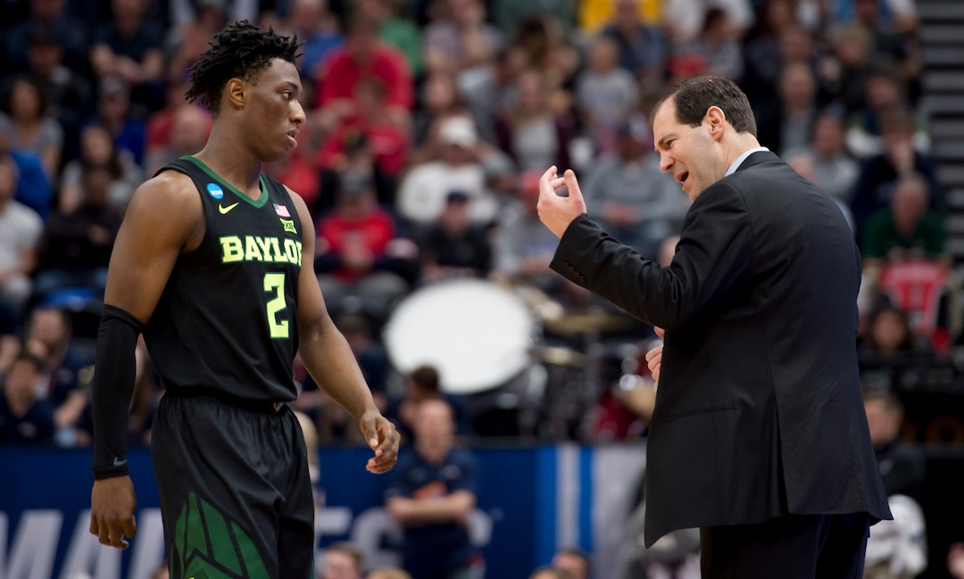 (Leah Hogsten  | The Salt Lake Tribune)  Baylor Bears head coach Scott Drew talks to Baylor Bears guard Devonte Bandoo (2) as Baylor faces Gonzaga in the second round of the NCAA tournament in Salt Lake City on Saturday, March 23, 2019.