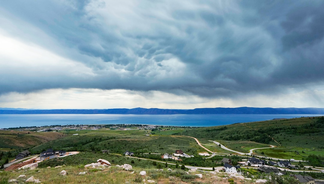 (Francisco Kjolseth | The Salt Lake Tribune) Homes and new construction speckles the hillside near Bear Lake above Garden City on Thursday, June 30, 2022. A new study is out showing the economic contributions of Bear Lake, underscoring the need to keep the lake healthy.
