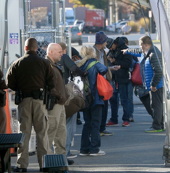 (Al Hartmann | The Salt Lake Tribune)
Starting Friday Oct. 27 homeless check in at booth atleft to have their coordinated services card scanned before passing into the "safe space" courtyard outside the Road Home shelter. Security provided by the Utah Highway Patrol. The area is accessible from the south on Rio Grand Street. The area to the north at 200 South and Rio Grand is fenced and locked.