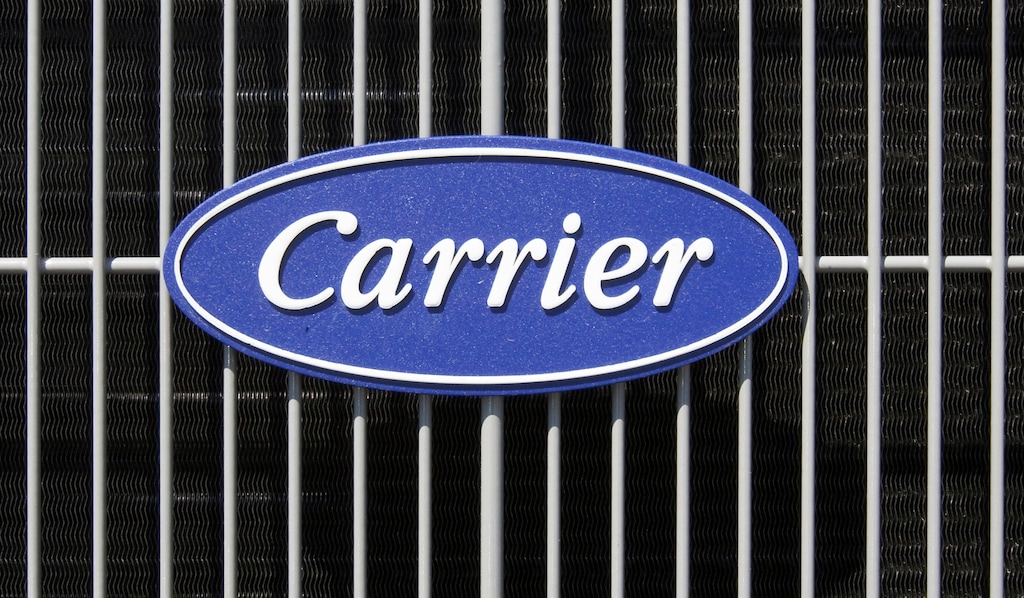 (Nati Harnik | AP file photo) The Carrier logo on an air conditioning unit in Omaha, Neb.