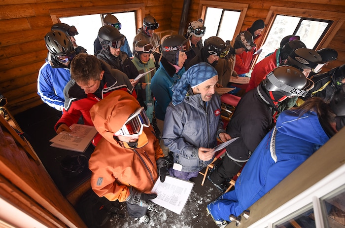 (Francisco Kjolseth | The Salt Lake Tribune) Packed shoulder to shoulder clad in winter ski gear, worshippers participate in a Friday afternoon Jewish Sabbath service inside Sunset Cabin on the upper slopes of Deer Valley Resort. Jan. 26, 2018.