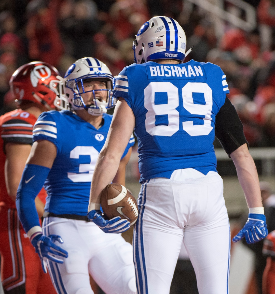 (Rick Egan  |  The Salt Lake Tribune)      Brigham Young Cougars tight end Matt Bushman (89) celebrates his touchdown with tight end Dallin Holker (32), in football action between the Brigham Young Cougars and the Utah Utes, at Rice-Eccles Stadium, Saturday, November 24, 2018.