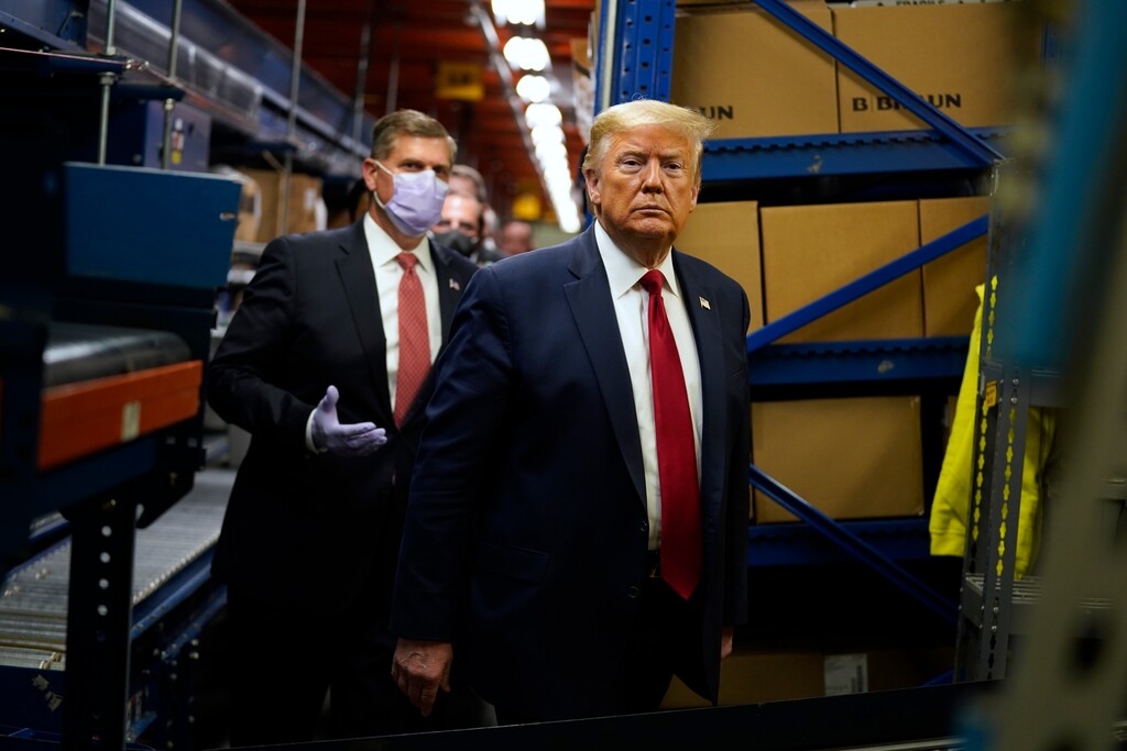 President Donald Trump participates in a tour of Owens & Minor Inc., a medical supply company, Thursday, May 14, 2020, in Allentown, Pa. (AP Photo/Evan Vucci)