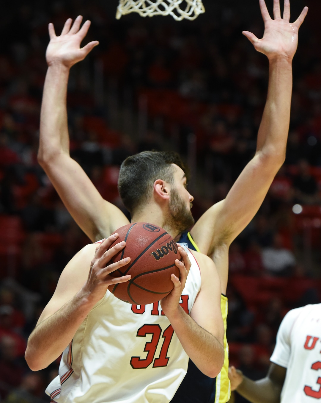 (Francisco Kjolseth  |  The Salt Lake Tribune) Utah Utes center Brandon Morley (31) appears to sprout arms as the battles Northern Arizona  in Men's Basketball at the Jon M Huntsman Center in Salt Lake City, Utah, on Friday, Dec. 21, 2018.