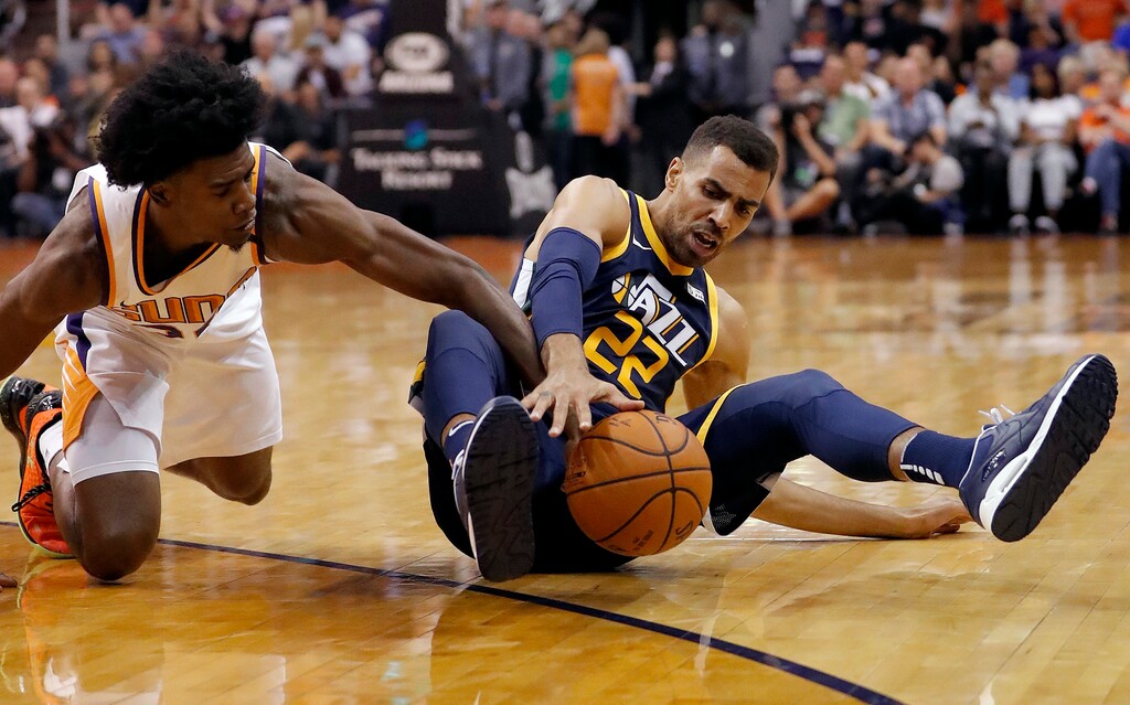 Utah Jazz forward Thabo Sefolosha (22) loses the ball as Phoenix Suns forward Josh Jackson, left, pursues during the first half of an NBA basketball game, Wednesday, Oct. 25, 2017, in Phoenix. (AP Photo/Matt York)