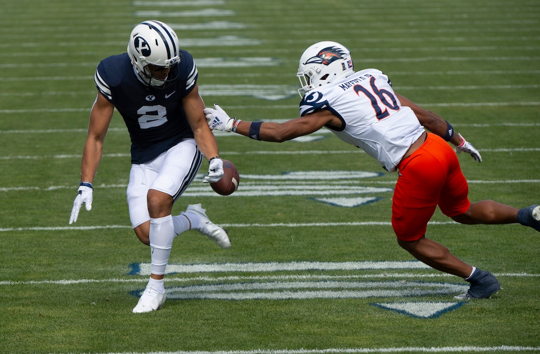 (Rick Egan  |  The Salt Lake Tribune)    Brigham Young Cougars wide receiver Neil Pau'u (2) has the ball stripped by UTSA Roadrunners cornerback Corey Mayfield Jr. (26), resulting in a fumble, in football action between the Brigham Young Cougars and the UTSA Roadrunners, at Lavell Edwards stadium, Saturday, Oct. 10, 2020.