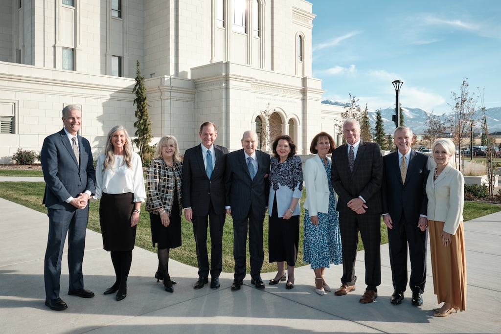 (The Church of Jesus Christ of Latter-day Saints) President Russell M. Nelson, center, arrives at the Deseret Peak Utah Temple for its dedication on Sunday, Nov. 10, 2024. Nelson is joined by Brian K. Taylor, general authority Seventy, and his wife, Jill Taylor, far left); apostle Gary E. Stevenson and his wife, Lesa, left; Nelson's wife, Wendy Nelson; Brook P. Hales, general authority Seventy, and his wife, Denise (right); and Kevin R. Duncan, General Authority Seventy, and his wife, Nancy, right.