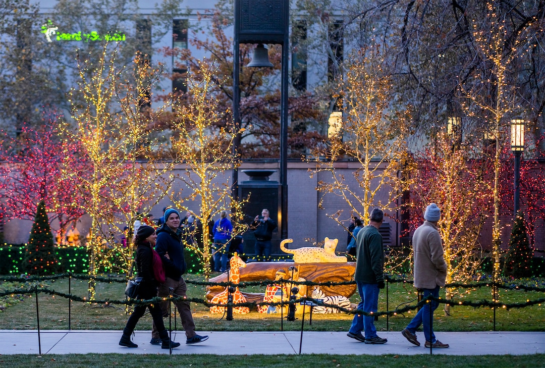 (Rick Egan | The Salt Lake Tribune) Visitors look at the lights on Temple Square, on Friday, Nov. 25, 2022.