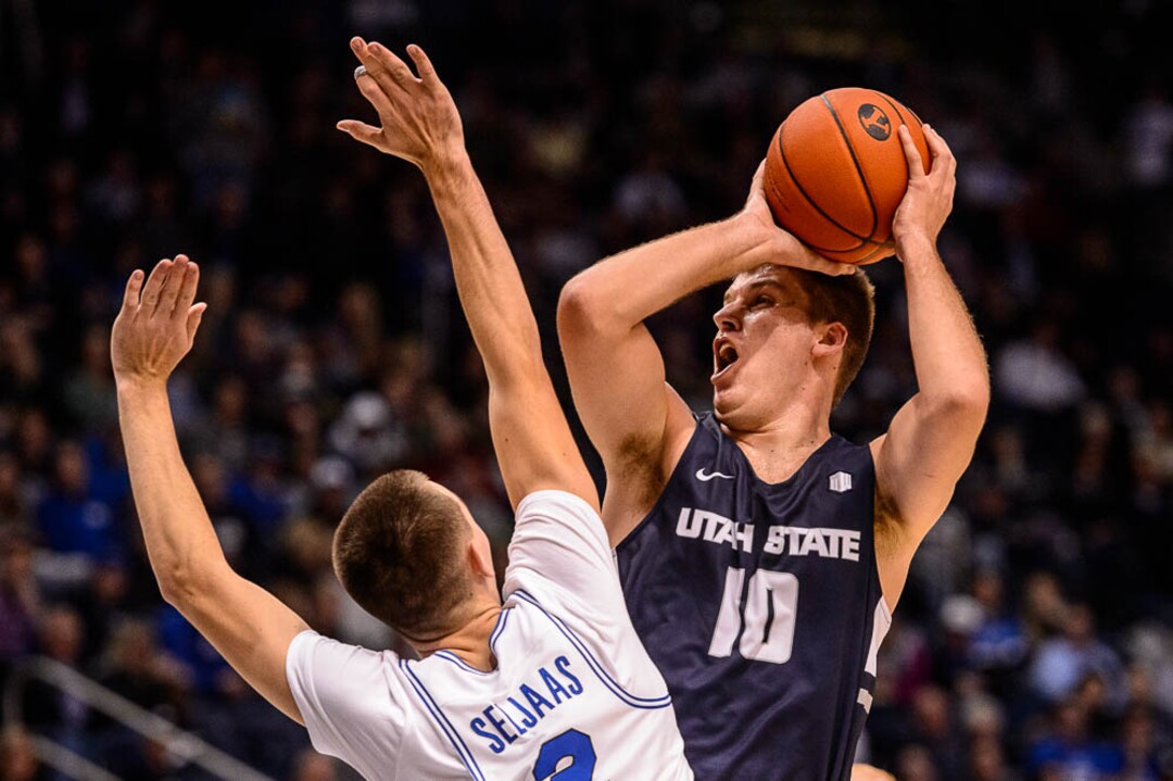 (Trent Nelson | The Salt Lake Tribune)  Utah State Aggies forward Quinn Taylor (10) defended by Brigham Young Cougars guard Zac Seljaas (2) as BYU hosts Utah State, NCAA basketball in Provo on Wednesday Dec. 5, 2018.