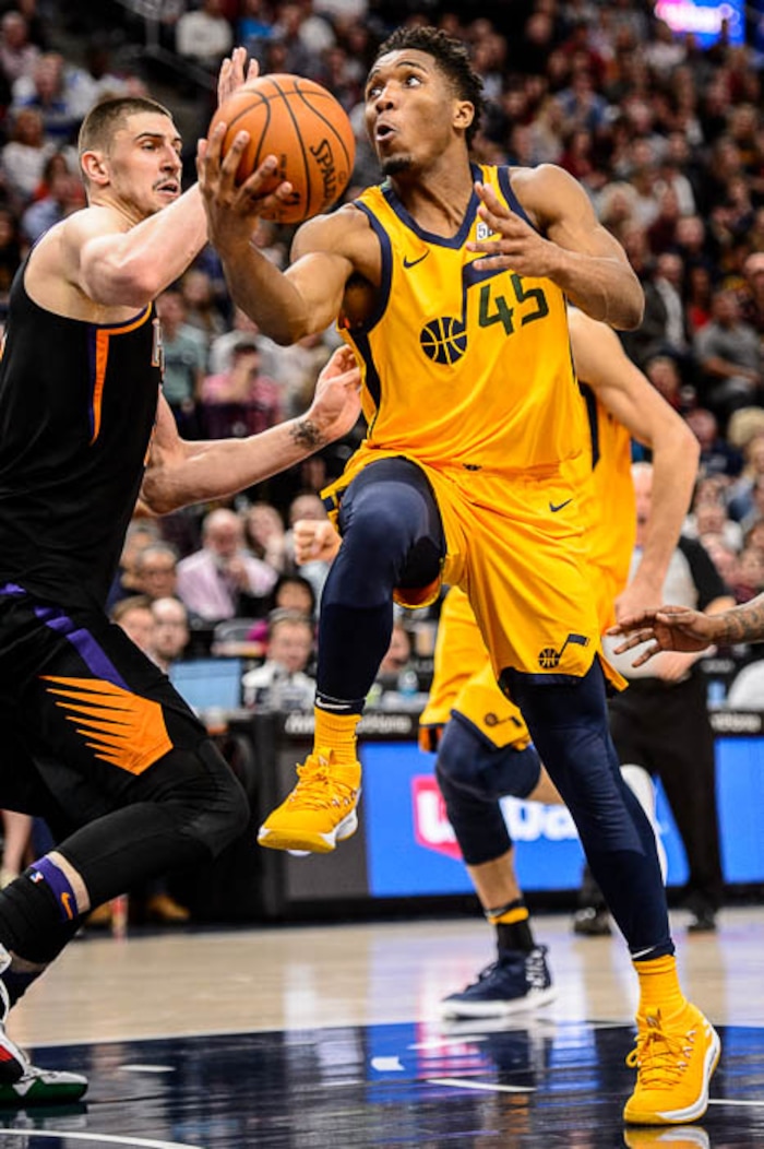 (Trent Nelson | The Salt Lake Tribune)  Utah Jazz guard Donovan Mitchell (45) shoots as the Utah Jazz host the Phoenix Suns, NBA basketball in Salt Lake City, Wednesday Feb. 14, 2018.