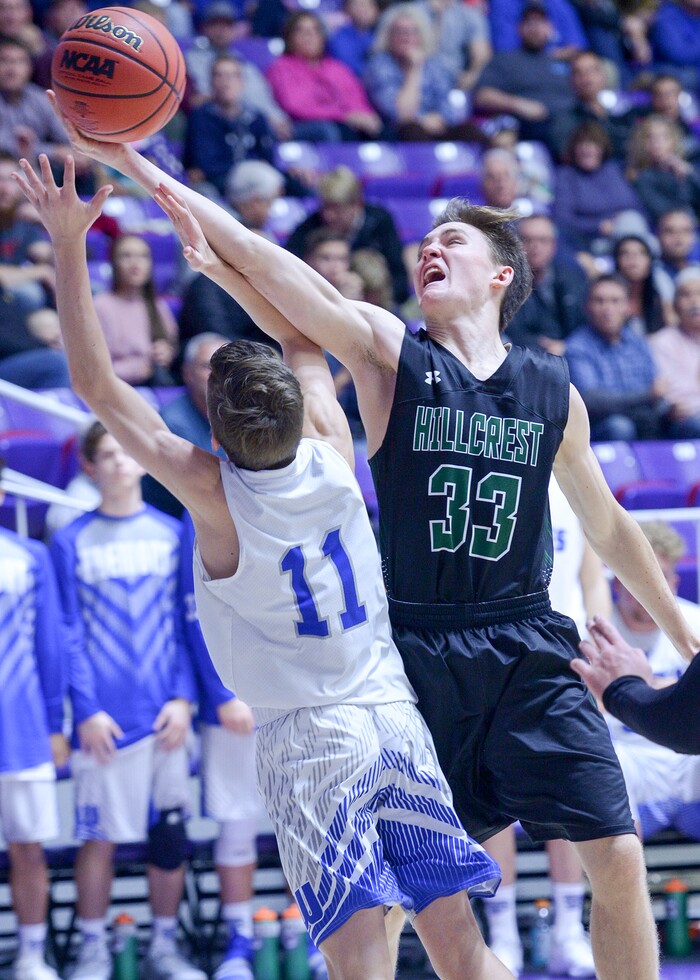 (Leah Hogsten  |  The Salt Lake Tribune) Hillcrest's Devin Adams (33) pulls in the rebound.Fremont defeated Hillcrest 62-52 in the 6A High School Boys' Basketball Tournament opening game at Weber State University’s Dee Events Center in Ogden, Tuesday, Feb. 27, 2018. 