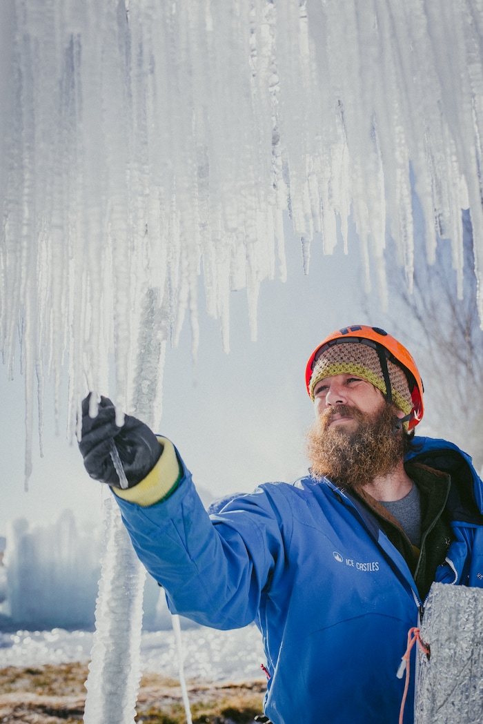(Angela Napolitano |  courtesy of Ice Castles) An artisan checks the growth of icicles for the Ice Castles installation in Midway, Utah. The one-acre walk-through ice-and-light show is expected to open to the public in late December.