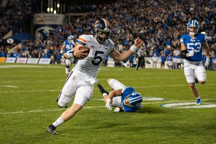 (Trevor Christensen | Special to The Tribune) Virginia's Brennan Armstrong runs the ball against Brigham Young University during the first half at LaVell Edwards Stadium on Saturday, Oct. 30, 2021, in Provo.