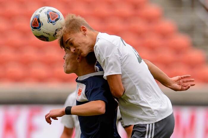 (Trent Nelson  |  The Salt Lake Tribune)  
Brighton's Cameron Neeley (12) and Olympus's Edvin Sabic (22) as Olympus faces Brighton High School in the 5A boys state championship game at Rio Tinto Stadium in Sandy, Thursday May 23, 2019.