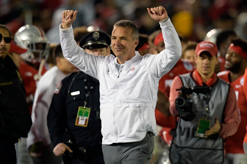 FILE - In this Tuesday, Jan. 1, 2019 file photo, Ohio State coach Urban Meyer celebrates at the end of the team's 28-23 win over Washington during the Rose Bowl NCAA college football game in Pasadena, Calif. Urban Meyer is headed back to television. Fox announced on Monday, March 11, 2019 that they have hired the former Ohio State coach as one of the analysts for its retooled college football pregame show. Fox also announced that it has hired Reggie Bush and will move Brady Quinn from the booth to the studio. (AP Photo/Mark J. Terrill, File)
