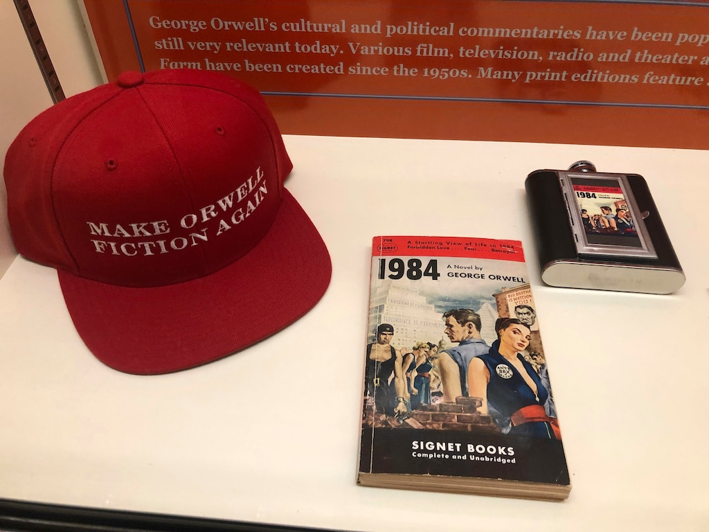 (Russell Contreras | AP file photo)  In this Oct. 23, 2019, photo, a vintage copy of George Orwell's 1949 novel "1984" next to a hat about Orwell is shown at an exhibit in Albuquerque, N.M., celebrating the author's legacy.