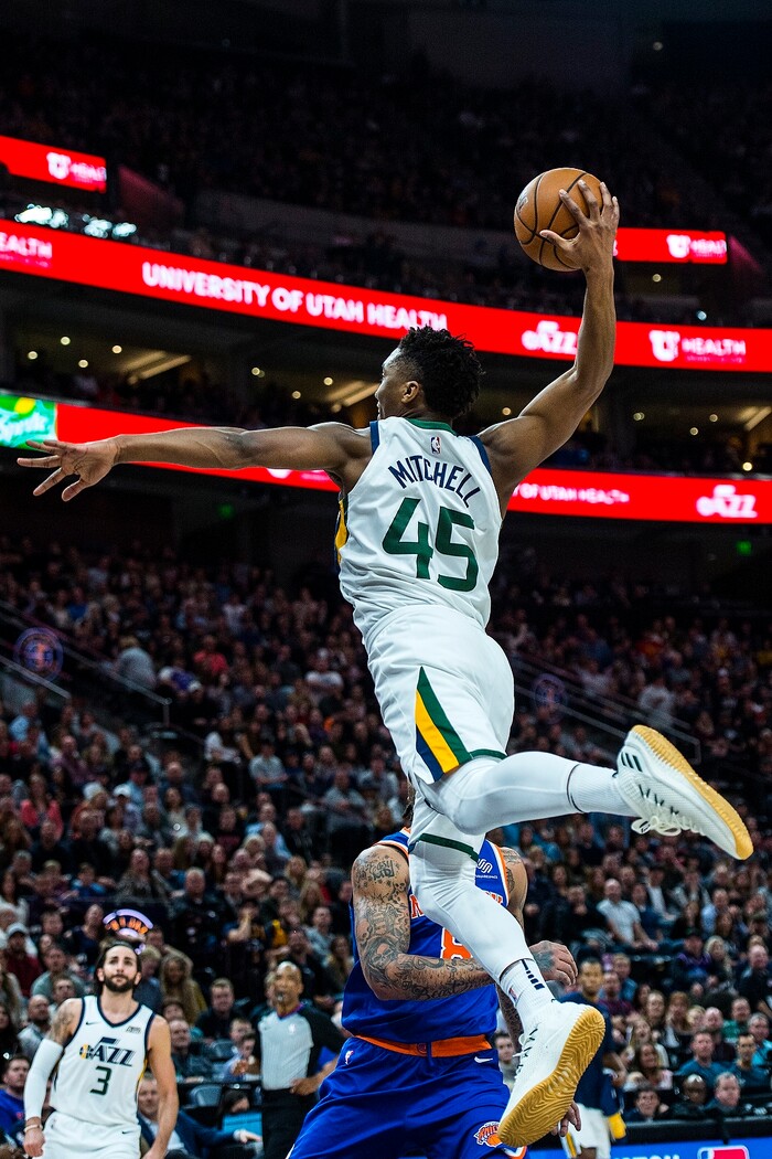 (Chris Detrick  |  The Salt Lake Tribune)  Utah Jazz guard Donovan Mitchell (45) goes up for a dunk past New York Knicks forward Michael Beasley (8) during the game at Vivint Smart Home Arena Friday, January 19, 2018.  Utah Jazz guard Donovan Mitchell (45) missed the dunk. 