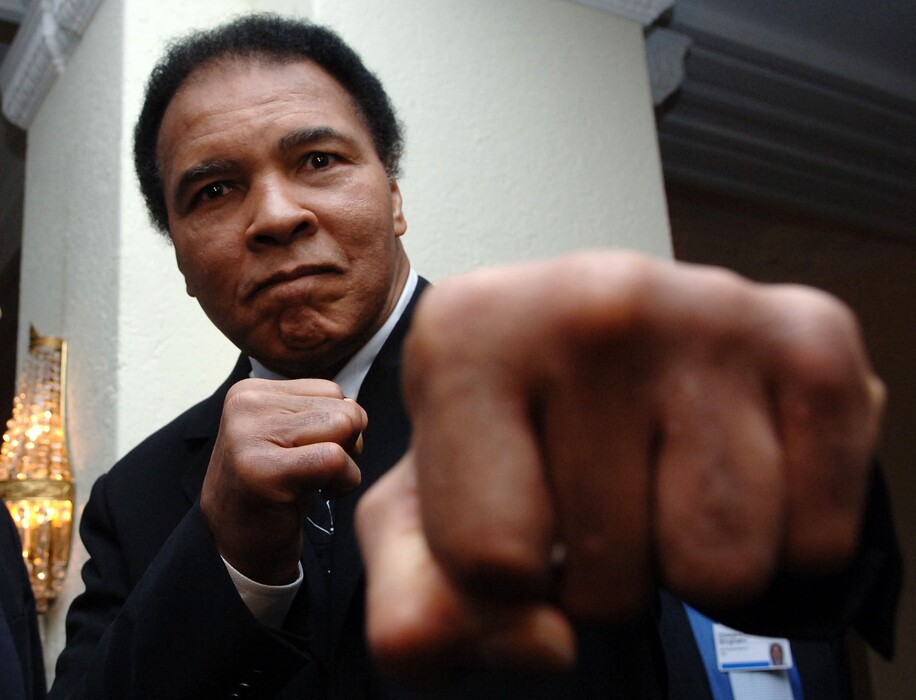 (Adam Berry | Bloomberg) Muhammad Ali poses at the World Economic Forum in Davos, Switzerland, Saturday, January 28, 2005.