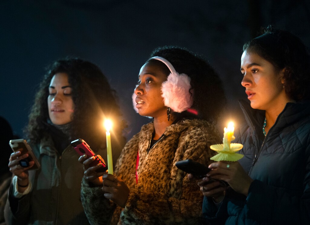 (Rick Egan  |  Tribune file photo)   In this Dec. 7, 2018, file photo Losa Smith, Jodian Grant, Joanna Hildreth-Castrejon sing with the BYU Women of Color Club, during a candlelight vigil on the Provo school's campus for a student who died by suicide that week.