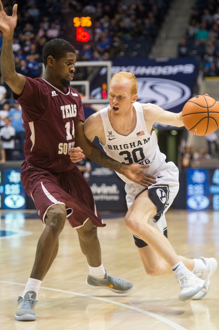 (Rick Egan  |  The Salt Lake Tribune)   Brigham Young Cougars guard TJ Haws (30) tries to get past Texas Southern Tigers forward Lamont Walker (14), in basketball action, Brigham Young Cougars vs Texas Southern Tigers, at the Marriott Center in Provo, Saturday, December 23, 2017.