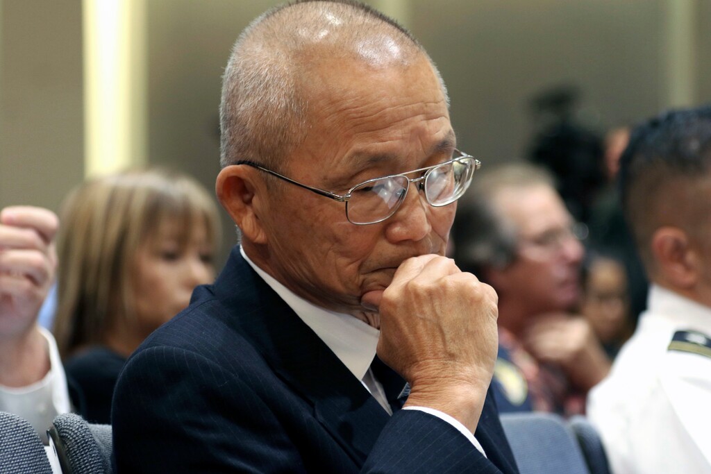 Hawaii Emergency Management Agency Administrator Vern Miyagi listens during a hearing in Honolulu, Friday, Jan. 19, 2018. Lawmakers want to learn the circumstances of an emergency alert mistakenly sent over the weekend that warned island residents and visitors of a ballistic missile attack.  (AP Photo/Jennifer Sinco Kelleher).