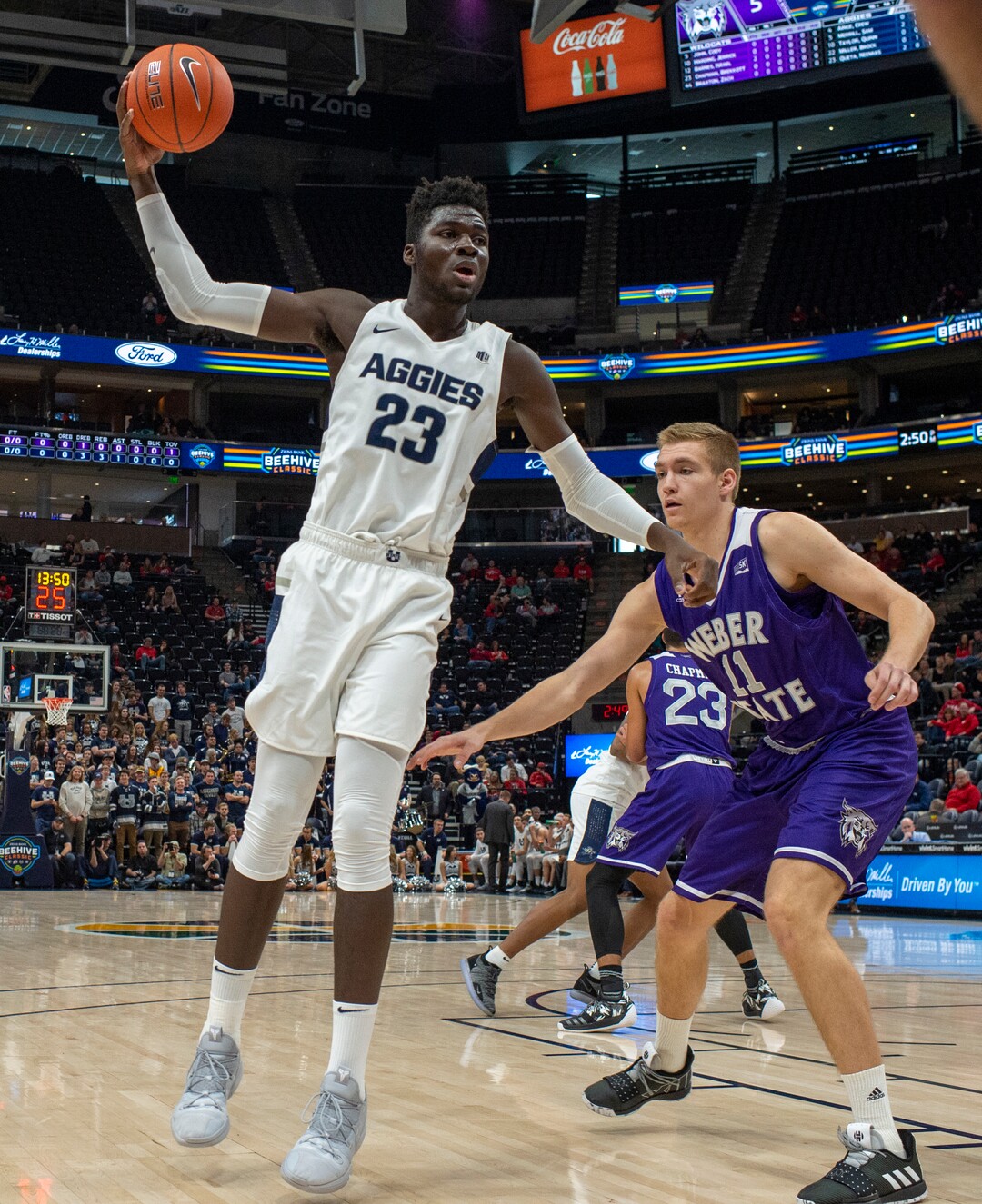 (Rick Egan  |  The Salt Lake Tribune)   Utah State Aggies center Neemias Queta (23), looks for an open man, as Weber State Wildcats forward Michal Kozak (11) defends, in the Beehive Classic, between against the Utah State Aggies and Weber State Wildcats, a the Vivint Smart Home Arena, Saturday December 8, 2018. 