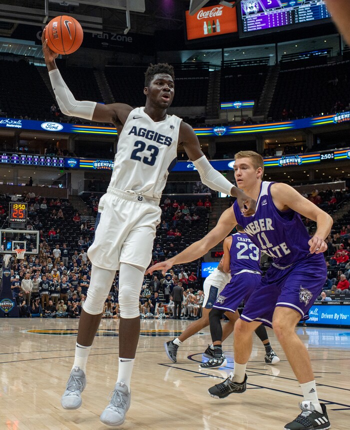 (Rick Egan  |  The Salt Lake Tribune)   Utah State Aggies center Neemias Queta (23), looks for an open man, as Weber State Wildcats forward Michal Kozak (11) defends, in the Beehive Classic, between against the Utah State Aggies and Weber State Wildcats, a the Vivint Smart Home Arena, Saturday December 8, 2018.

 