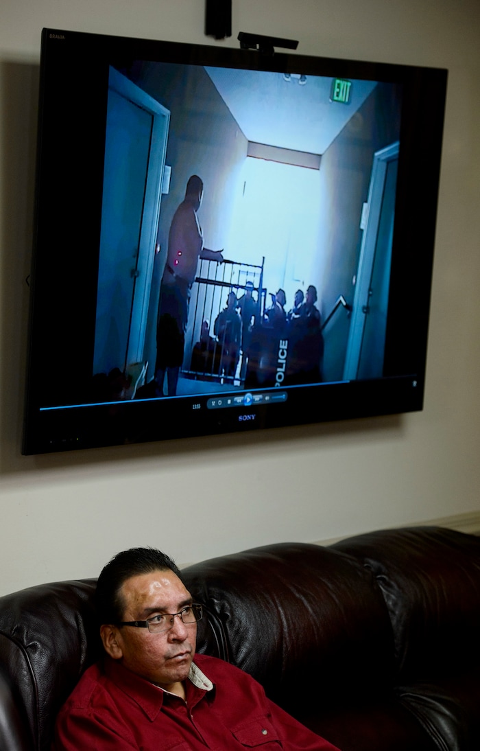 (Steve Griffin  |  The Salt Lake Tribune) Fernando Coronado sits below a tv screen as attorney Robert Sykes plays the West Valley City police body camera video where two officers tased Coronado after Coronado's wife, Tabaththa Coronado, called them concerned that he was suicidal. Coronado suffered brain damage when he fell and hit his head on a stucco wall and a concrete floor, as a result of being stunned. Sykes has filed a federal lawsuit against the two West Valley City police officers. The news conference was in Sykes offices in Salt Lake City Thursday January 25, 2018.