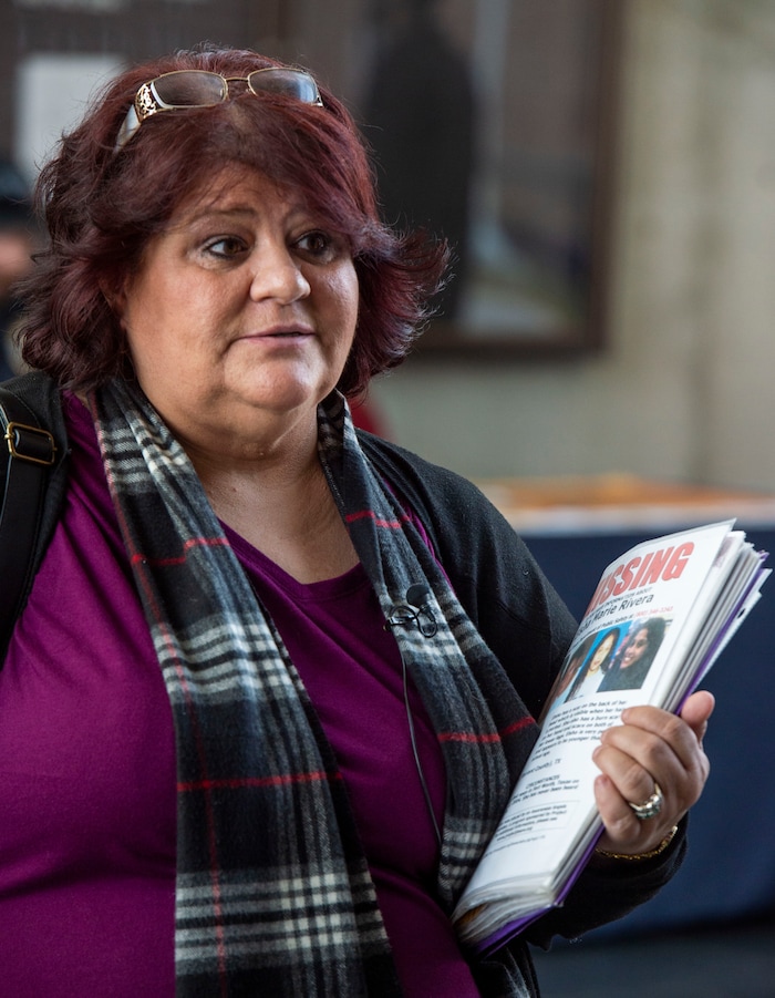 (Rick Egan  |  The Salt Lake Tribune)   Elizabeth Rivera holds a poster with photos of her daughter Elsha, who went missing in 2004, at the inaugural Missing In Utah event in Sandy. The Salt Lake City Police Department, and nonprofit organizations invited people to come talk with them about opening a new, or adding to an existing, missing person case. Saturday, March 9, 2019.


