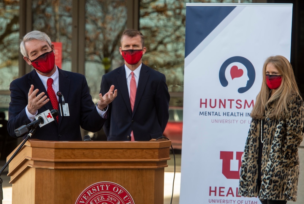 (Rick Egan | The Salt Lake Tribune) Mark Rapaport speaks at the dedication and launch of the Huntsman Mental Health Institute (HMHI), formerly University Neuropsychiatric Institute (UNI), on Thursday, Jan. 14, 2021. David Huntsman and Christena Huntsman Durham, of the Huntsman Foundation, which provided a $150 million gift toward HMHI, stand behind Rapaport.