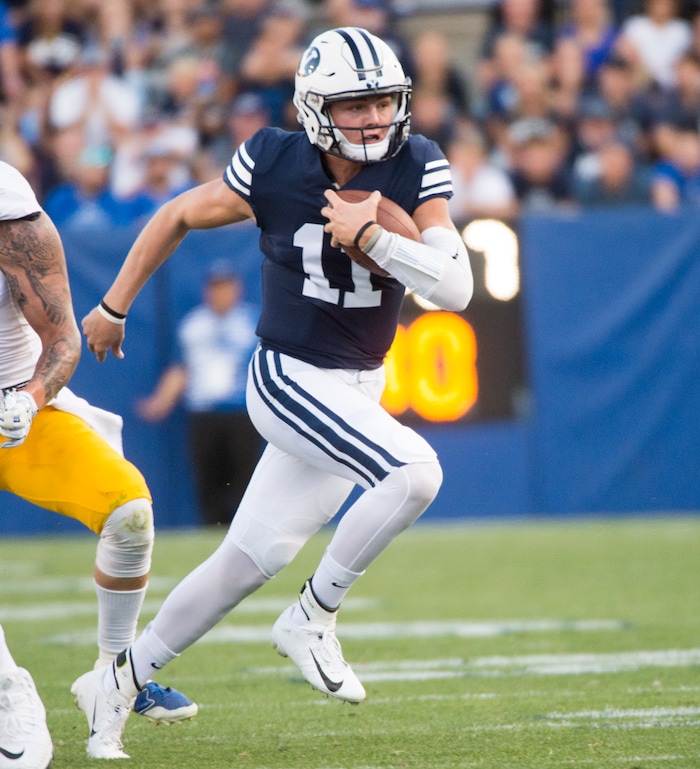 (Rick Egan  |  The Salt Lake Tribune)    Brigham Young Cougars quarterback Zach Wilson (11) runs the ball for the Cougars on a quarterback keeper, in football action Brigham Young Cougars vs. McNeese State Cowboys, at Lavell Edwards Stadium, Saturday, Sept. 22, 2018.


