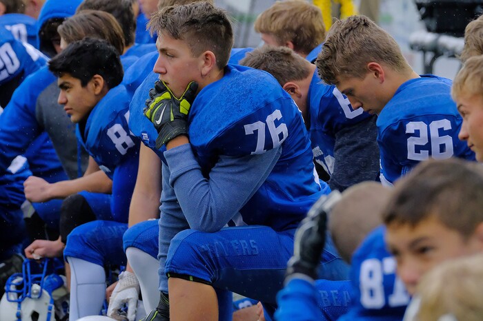 (Leah Hogsten  |  The Salt Lake Tribune) Beaver's sideline watches as Cole Marshall leaves the field with an injured ankle.  Beaver High School boys' football team defeated Delta High School 35-16 during their class 2A state semifinal football game Saturday, November 4, 2017 at Weber State University's Stewart Stadium.