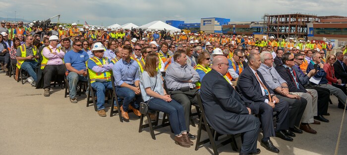 (Leah Hogsten  |  The Salt Lake Tribune) The Salt Lake City International Airport held a "topping out" ceremony to raise the last steel beams to a high point on the new terminal building, Wednesday, May 23, 2018. The new $485 million terminal building will cover 866,087 square feet. It used 11,000 tons of structural steel and 22 miles of steel piles. The building will house a 6.2 mile conveyor system for baggage.
