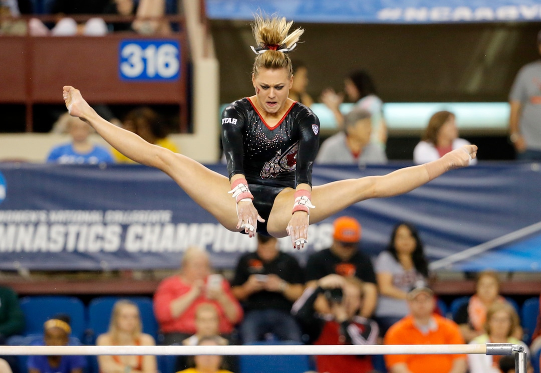 Utah's Tiffani Lewis competes on the uneven parallel bars during the NCAA women's gymnastics championships, Friday, April 15, 2016, in Fort Worth, Texas. (AP Photo/Tony Gutierrez)