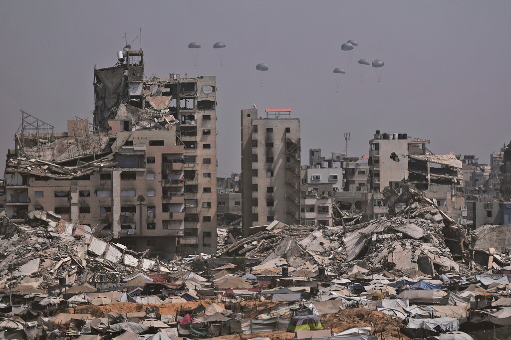 (Jehad Alshrafi | AP) Humanitarian aid is airdropped to Palestinians over Gaza City, Gaza Strip, Monday, July 28, 2025.