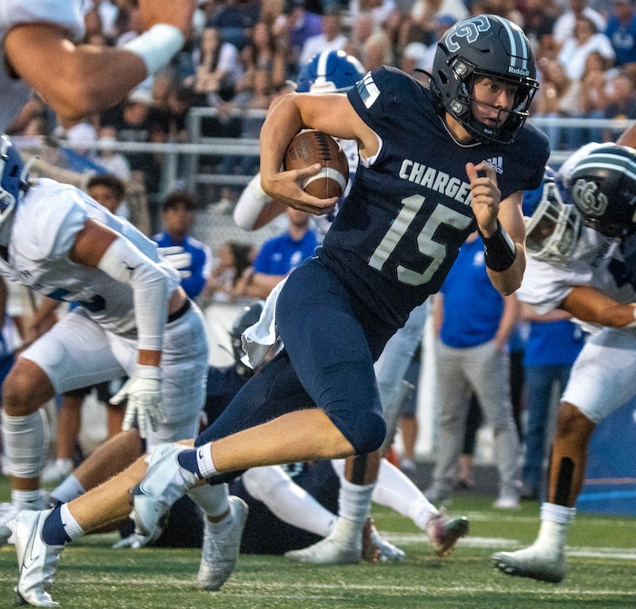 (Rick Egan | The Salt Lake Tribune) Corner Canyon quarterback Devin Brown runs for a Charger touchdown, in prep football action between the Corner Canyon Chargers and the Bingham Miners, on Friday, Aug. 27, 2021.