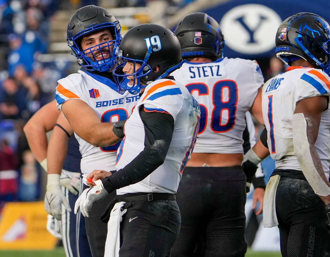 (Leah Hogsten | The Salt Lake Tribune) Boise State Broncos tight end Tyler Eiguren (86) celebrates the win with Boise State Broncos quarterback Hank Bachmeier (19) as No. 10 Brigham Young University hosts Boise State at LaVell Edwards Stadium, Oct. 9, 2021.