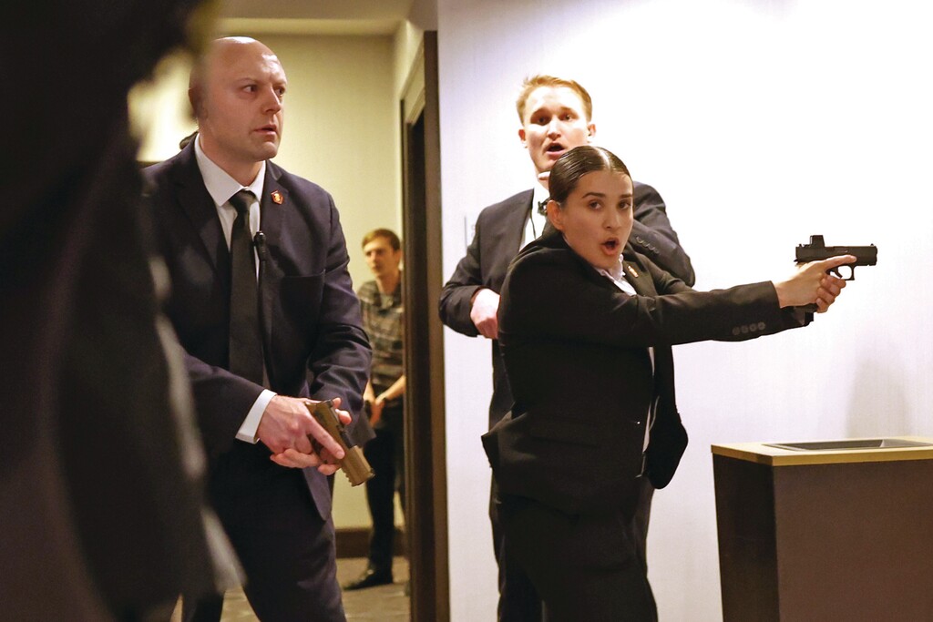 Secret service agents respond during the White House Correspondents Dinner, Saturday, April 25, 2026, in Washington. (AP Photo/Tom Brenner)