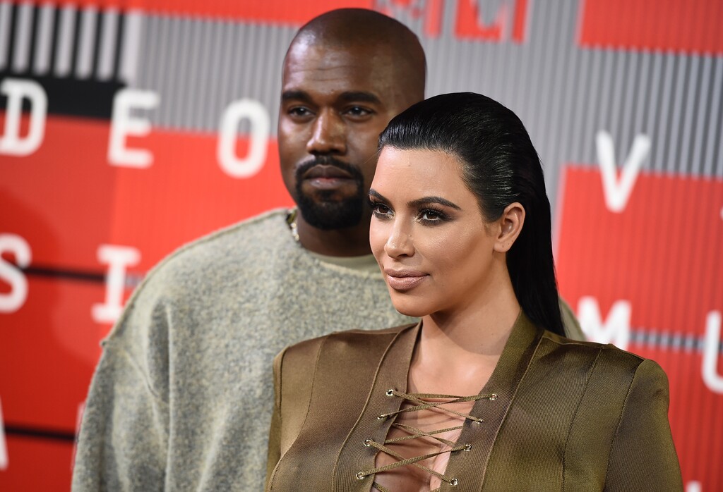 (Jordan Strauss | Invision | The Associated Press) Kanye West, left, and Kim Kardashian arrive at the MTV Video Music Awards at the Microsoft Theater on Sunday, Aug. 30, 2015, in Los Angeles.